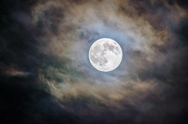 Full Moon in Sagittarius glowing in the night sky with mystical atmosphere