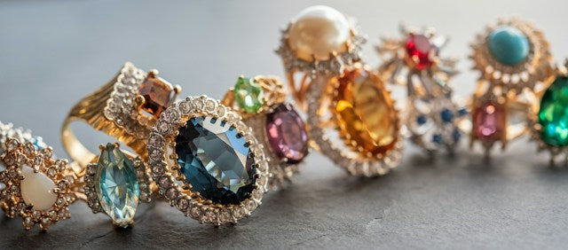 Natural gemstones in different colors set in rings and jewelry